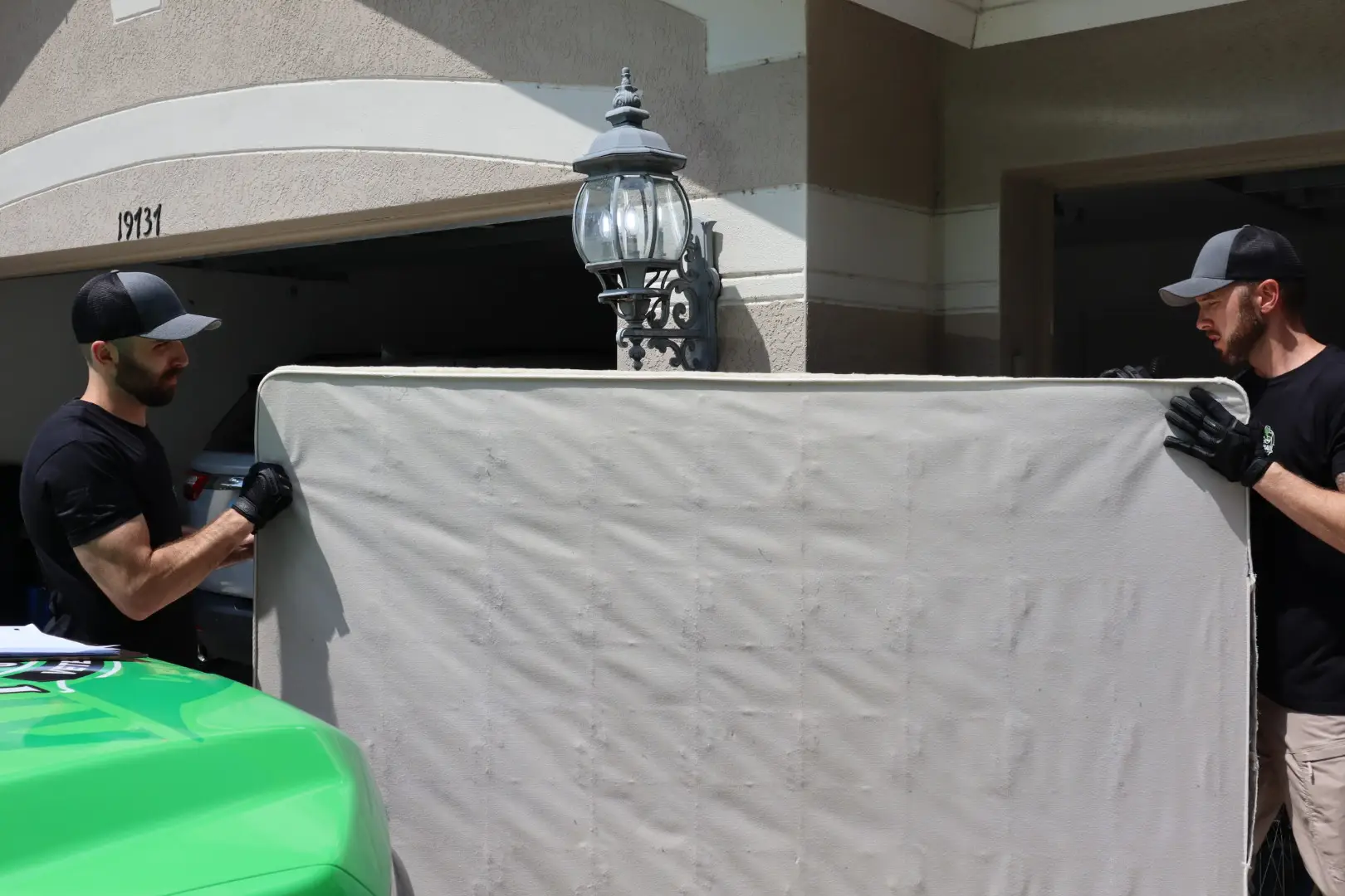 men removing a mattress