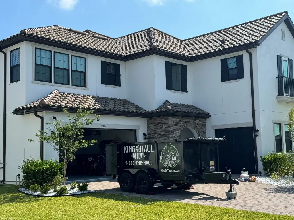 Dumpster Rentals in Tampa Bay, a dumpster in front of a house.